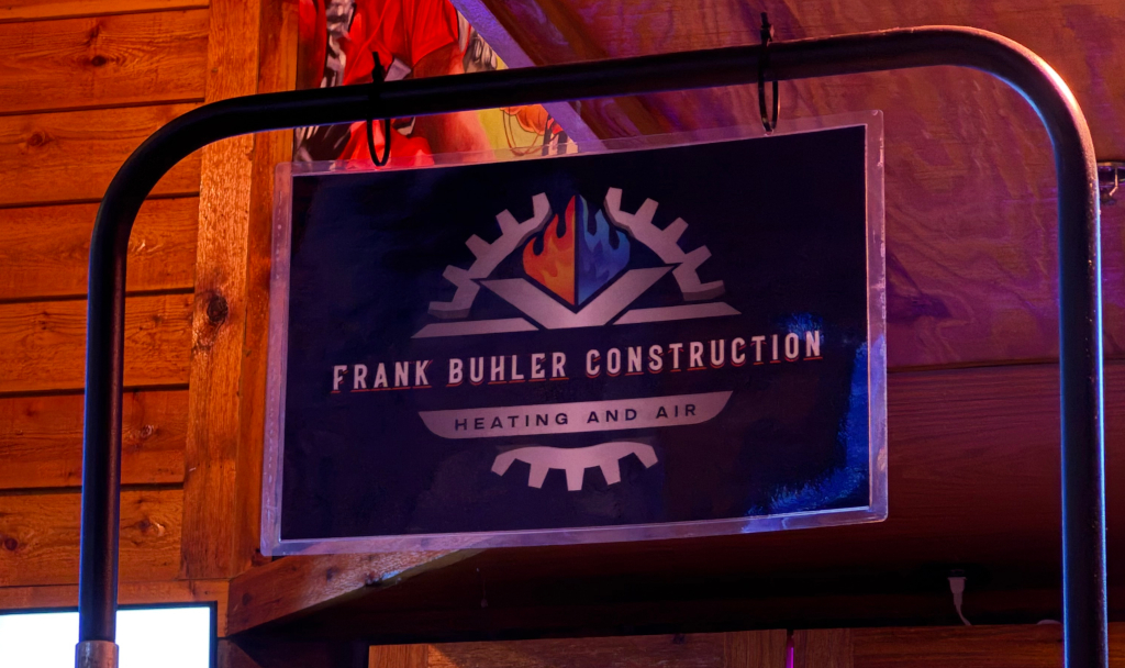Frank Buhler Construction banner hanging at the American Fork Texas Roadhouse